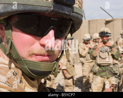 Selfie of a British Army infantry officer wearing uniform helmet and dark sunglasses on active duty in 2008. Helmand Province Afghanistan Stock Photo