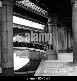 UK England Manchester Castlefield railway bridge over Bridgewater Canal passing through city centre Stock Photo