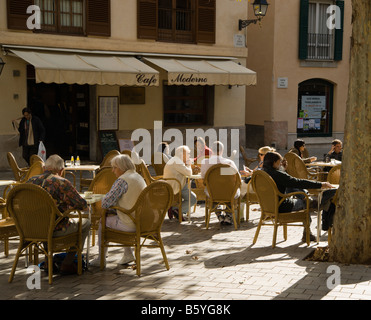 Outdoor cafe scene in mallorca with blurred people and defocused ...