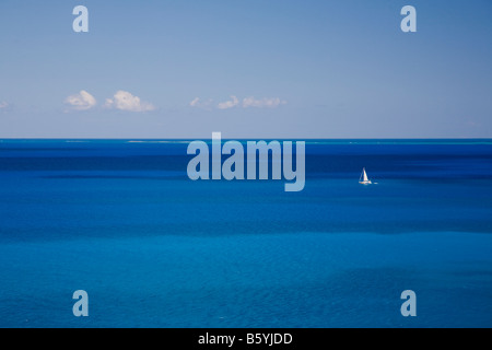 Sailboat in the Caribbean Sea off the island of Anguilla in the British West Indies Stock Photo