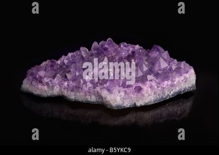 Amethyst crystal cluster on black background Stock Photo