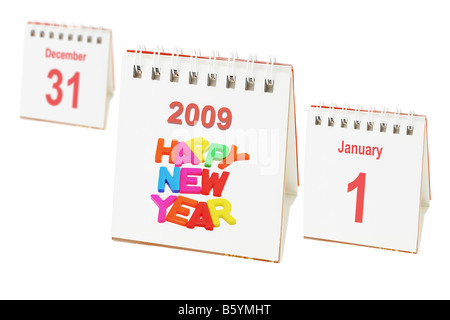 Desktop calendars showing passing of last day of the year and arrival of new year Stock Photo