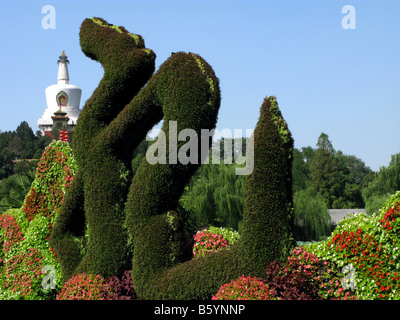 Dragon hedge sculpture near the White Pagoda atop Jade Islet in the Beihai Park in Beijing. Beijing China Asia Stock Photo