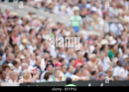 crowd fans spectaters blurred out of focus sports cricket soft background backdrop Stock Photo