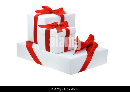 Three gift boxes with bow ribbons on white background Stock Photo - Alamy