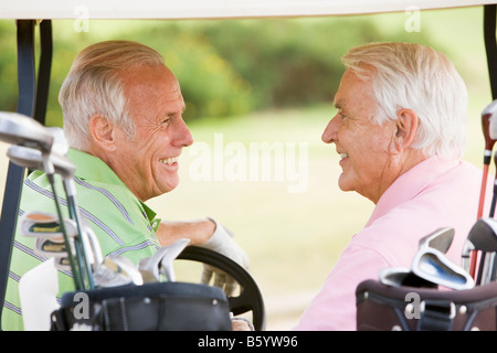 Male Friends Enjoying A Game Of Golf Stock Photo