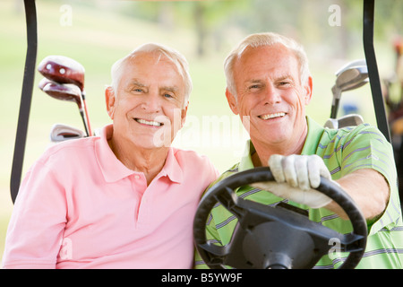 Male Friends Enjoying A Game Of Golf Stock Photo