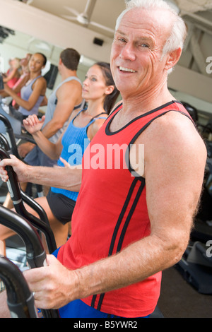 Man Running On Treadmill At Gym Stock Photo