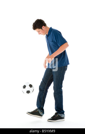 Portrait Of Teenage Boy With A Soccer Ball Stock Photo