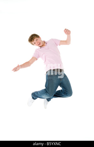 Teenage Boy Jumping In The Air Stock Photo