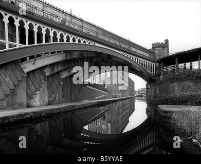 UK England Manchester Castlefield railway bridge over Bridgewater Canal passing through city centre Stock Photo