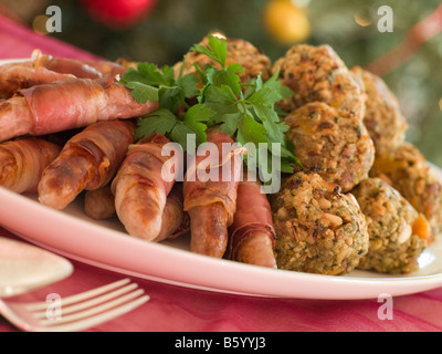 Plate of Pigs in Blankets and Chestnut Stuffing Balls Stock Photo