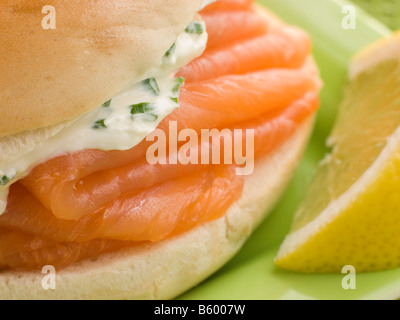 Smoked Salmon and Cream Cheese Bagel with a wedge of Lemon Stock Photo