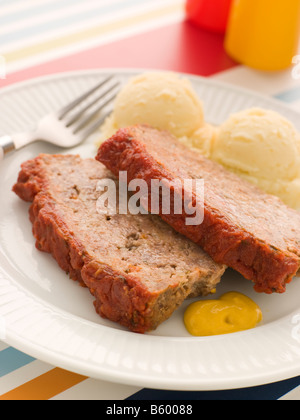 Meatloaf Baked in Tomato sauce with Mashed Potatoes and Mustard Stock Photo