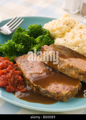 Mama's Meatloaf with Mashed Potato Broccoli Tomatoes and Gravy Stock Photo