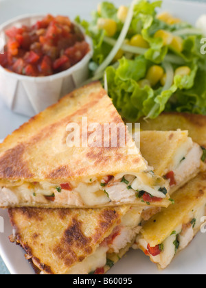 Quesadillas with Cajun Chicken Cheese Tomato Salsa and corn Salad Stock Photo