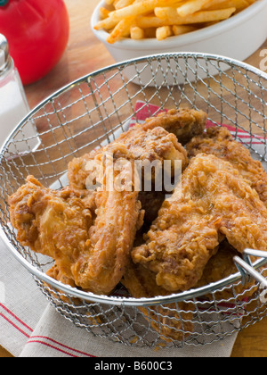 Southern Fried Chicken in a Basket with Fries Stock Photo