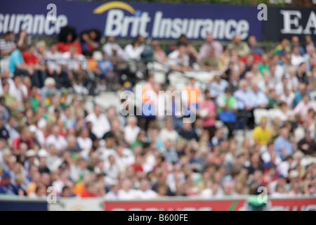 crowd fans spectaters blurred out of focus sports cricket soft background backdrop Stock Photo