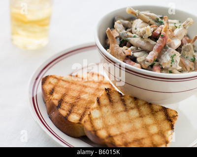 Fricassee of Frog Legs with Grilled Brioche Stock Photo