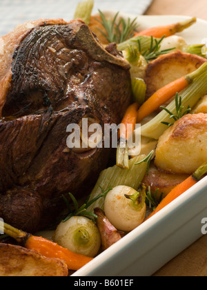 Roast Leg of Spring Lamb With Roast Potatoes and Vegetables Stock Photo
