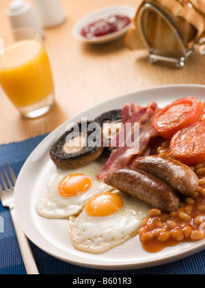 Full English Breakfast with Orange Juice Toast and Jam Stock Photo