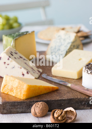 Selection of British Cheeses with Walnuts Biscuits and Grapes Stock Photo