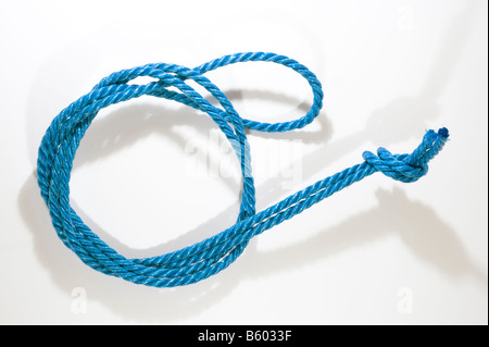 Coiled and knotted blue nylon rope Stock Photo