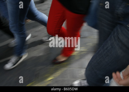 group young people in denim jeans walking in town Stock Photo