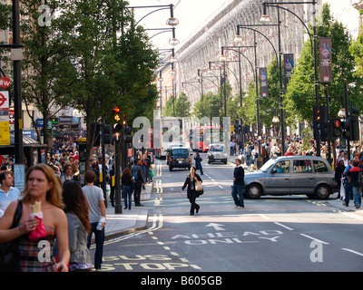 Oxford street shopping district with many people London UK Stock Photo