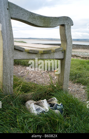 Lost pair of trainers on Lindisfarne, UK Stock Photo