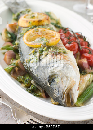 Whole Roasted Sea Bass with Fennel Lemon Cherry Vine Tomatoes and Salsa Verde
