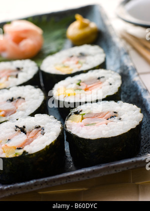 Large Spiral Rolled Sushi with Sushi Ginger Wasabi and Soy Sauce Stock Photo