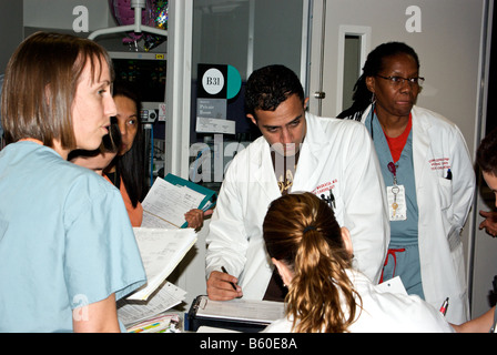 Medical team at Texas Childrens Hospital in consultation meeting in ward before going on their rounds Stock Photo