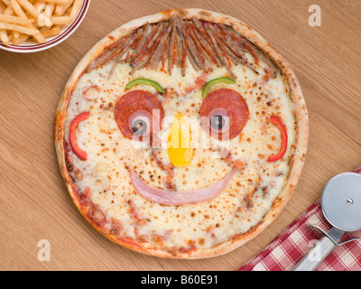 Smiley Faced Pizza with a Portion of Chips Stock Photo