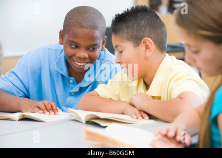 Students in class reading together (selective focus) Stock Photo