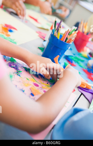 Students in art class focusing on hands (selective focus) Stock Photo