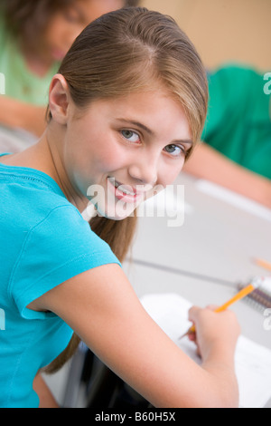 Student in class taking notes (selective focus) Stock Photo