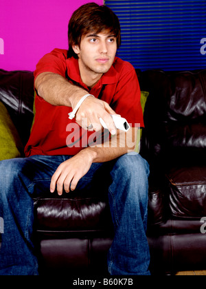 Young Man Playing On Wii Game Model Released Stock Photo