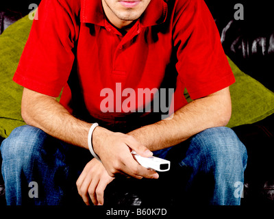 Young Man Playing On Wii Game Model Released Stock Photo