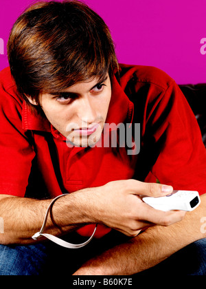 Young Man Playing On Wii Game Model Released Stock Photo