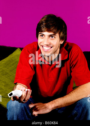 Young Man Playing On Wii Game Model Released Stock Photo