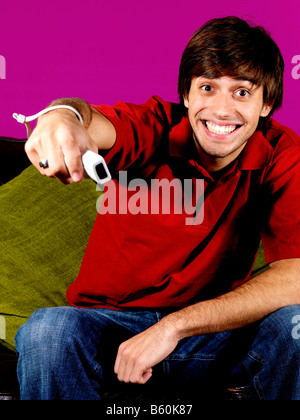 Young Man Playing On Wii Game Model Released Stock Photo