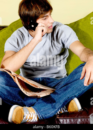 Young Man Using Mobile Telephone Model Released Stock Photo