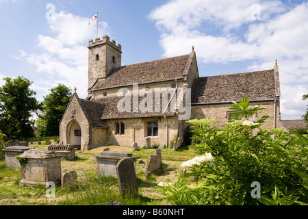 St Marys church in the Cotswold village of Swinbrook, Oxfordshire UK. The Mitford sisters are buried in the churchyard. Stock Photo