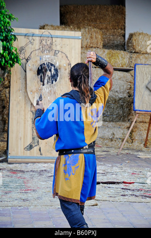 Axe throwing, target, man, costume, clothing, tradition, display, medieval market, medieval games, La Nucia, Costa Blanca Stock Photo