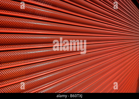 red metal shutter security door on a shop front Stock Photo