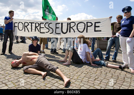 Fortress Europe, banner, street performance as protesters protest on the 15th anniversary of the amendment to the Basic Law of Stock Photo