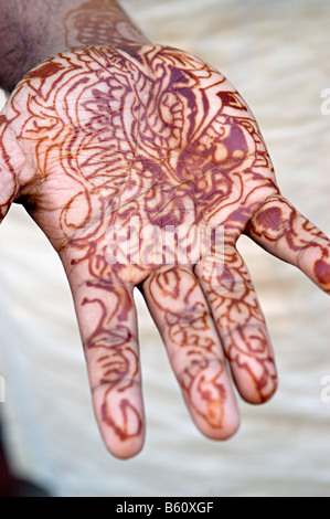 mehndi on a mans hand ready for his wedding Stock Photo