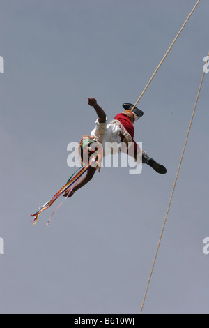 Member of the 'Mayan flying man' Sundance group descending from a 90 ft pole suspended by a rope Stock Photo
