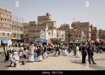 Souk, buildings made of brick clay, marketeers, square in front of the Bab El Yemen, Sana, UNESCO World Heritage Site, Yemen Stock Photo